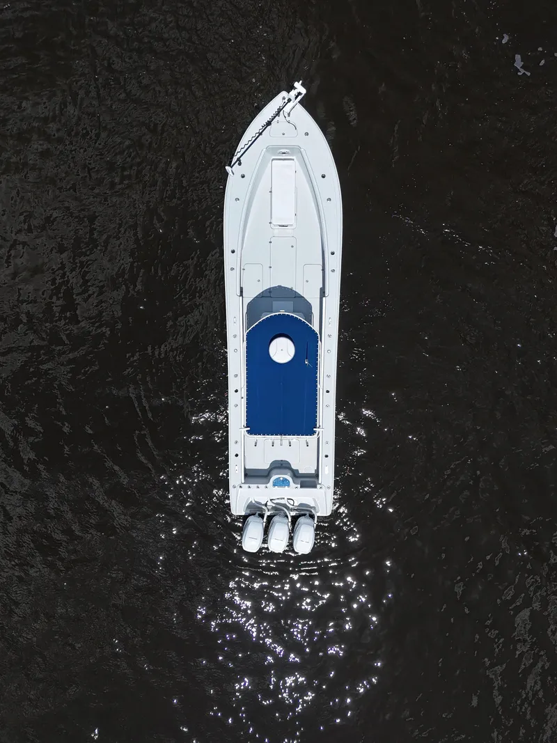 Slide: The Image of Aerial view of 2003 Yellowfin 36 Offshore boat on dark water. - 10