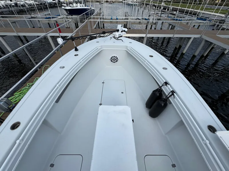 Slide: The Image of 2003 Yellowfin 36 Offshore boat docked at marina, view of bow and deck. - 18