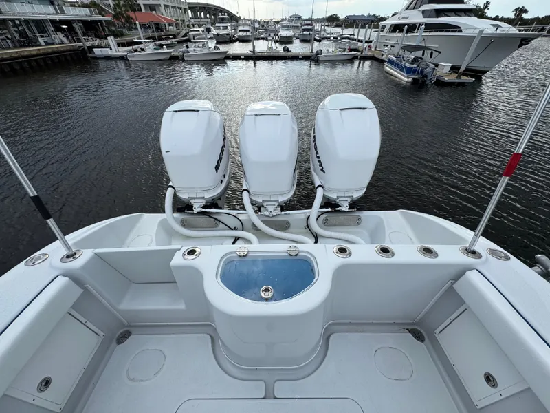 Slide: The Image of 2003 Yellowfin 36 Offshore boat with triple engines docked at marina. - 21