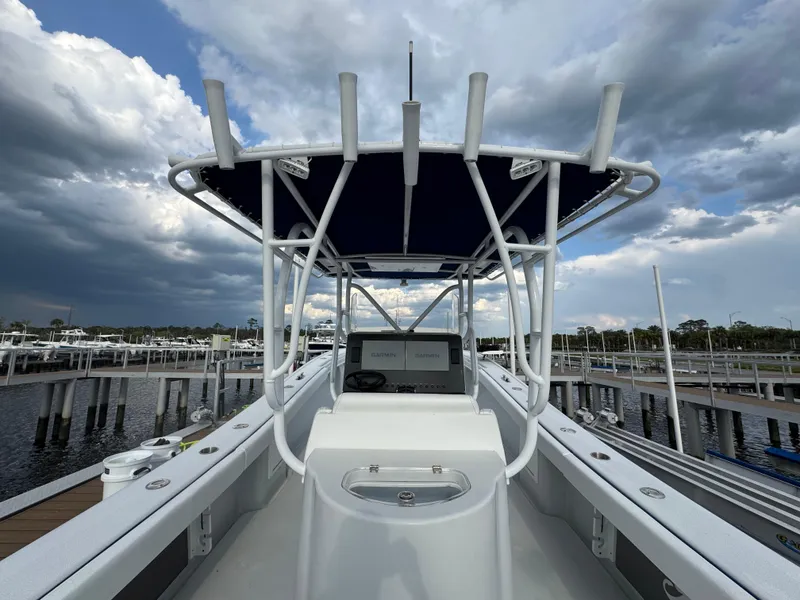 Slide: The Image of 2003 Yellowfin 36 Offshore boat docked under cloudy skies. - 22