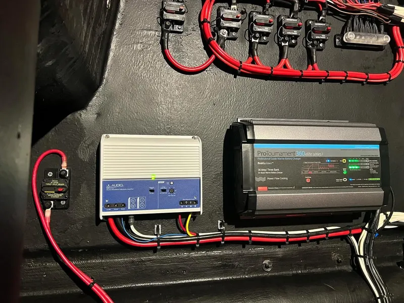Slide: The Image of Electrical components and wiring inside a 2003 Yellowfin 36 Offshore boat. - 28