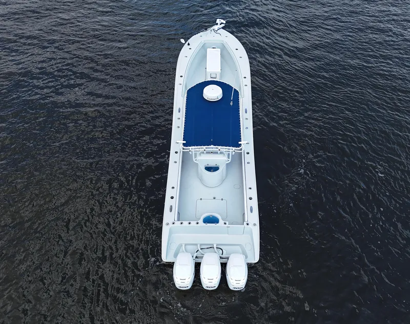 Slide: The Image of Aerial view of 2003 Yellowfin 36 Offshore boat on dark water. - 6