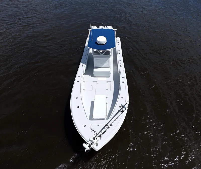 Slide: The Image of 2003 Yellowfin 36 Offshore boat on calm water, aerial view. - 8