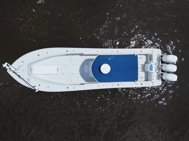 Slide: The Image of Aerial view of 2003 Yellowfin 36 Offshore boat on dark water. - 9