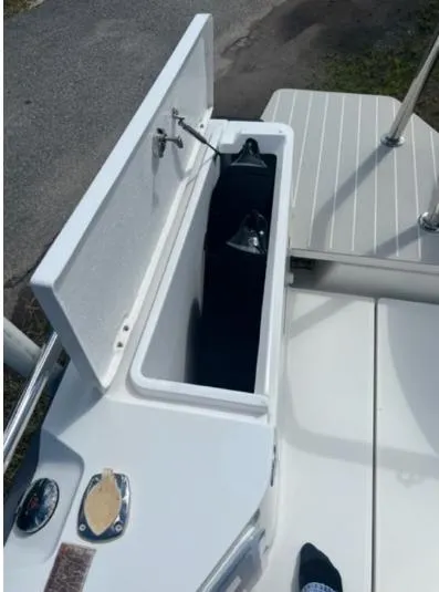 Slide: The Image of Open storage compartment on 2020 Axopar 28 boat deck. - 16