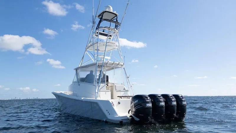 Slide: The Image of 2015 SeaVee 430 Fisharound boat with four powerful outboard engines on open water. - 10