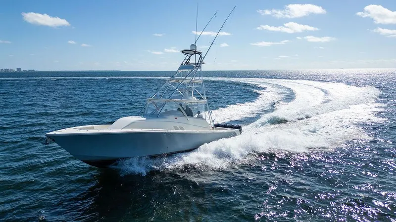 Slide: The Image of 2015 SeaVee 430 Fisharound cruising on open water under a clear sky. - 20