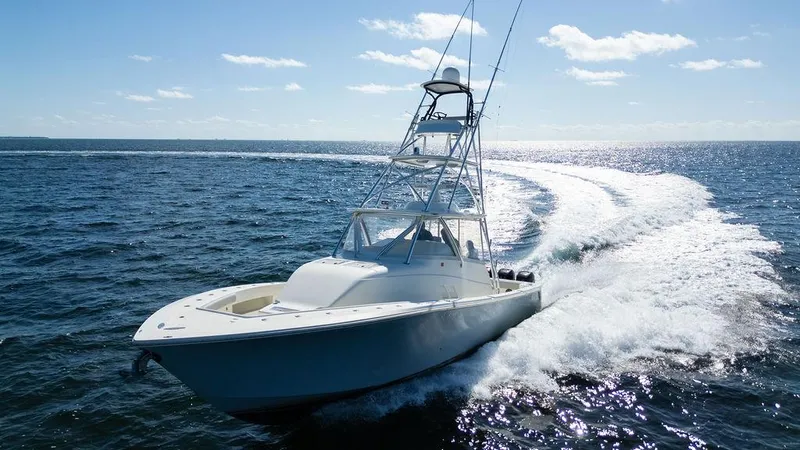 Slide: The Image of 2015 SeaVee 430 Fisharound cruising on open ocean, creating a dynamic water trail. - 21
