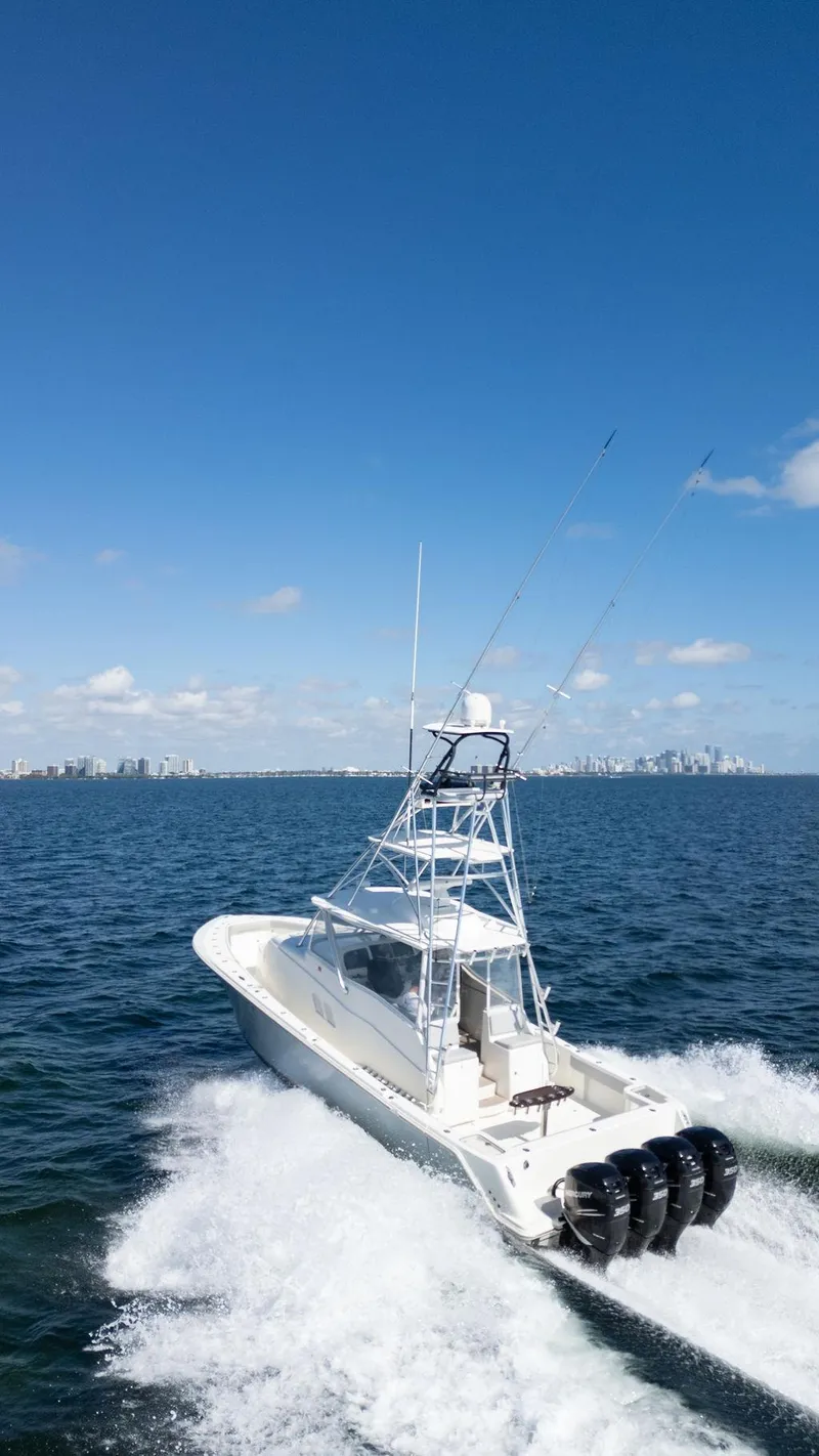 Slide: The Image of 2015 SeaVee 430 Fisharound cruising on open water under clear blue skies. - 35