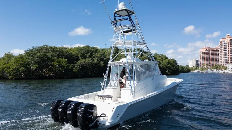 Slide: The Image of 2015 SeaVee 430 Fisharound boat cruising on a sunny day with four engines. - 40