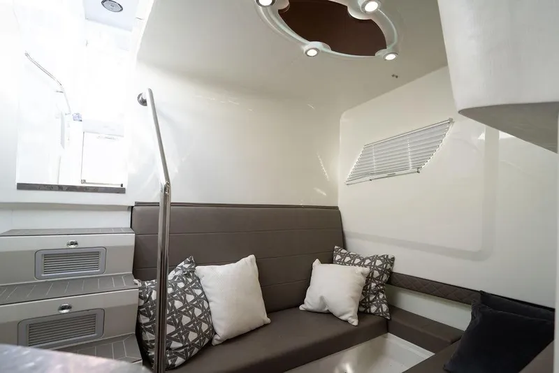 Slide: The Image of Interior of 2015 SeaVee 430 Fisharound, featuring modern seating and stylish cushions. - 43