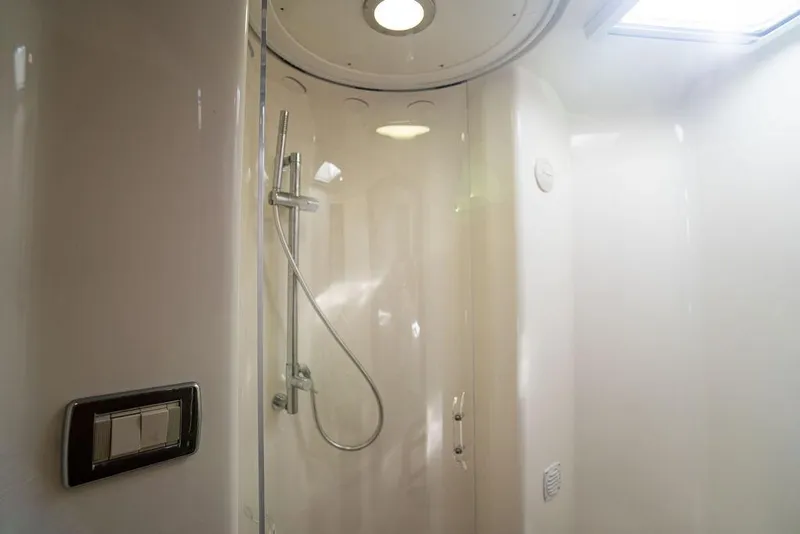 Slide: The Image of 2015 SeaVee 430 Fisharound shower interior with modern fixtures and lighting. - 49