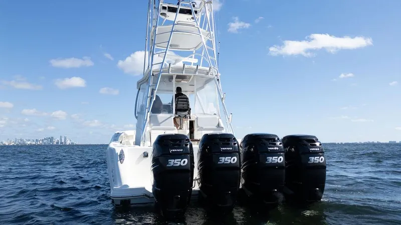 Slide: The Image of 2015 SeaVee 430 Fisharound boat with four powerful engines on open water. - 9