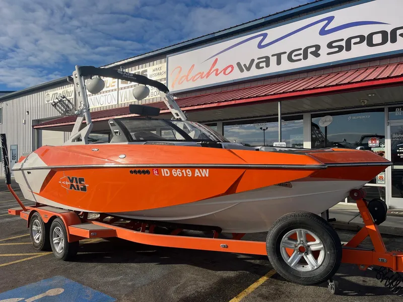 Slide: The Image of 2016 Axis Boats A22 in vibrant orange at Idaho Water Sports dealership. - 12