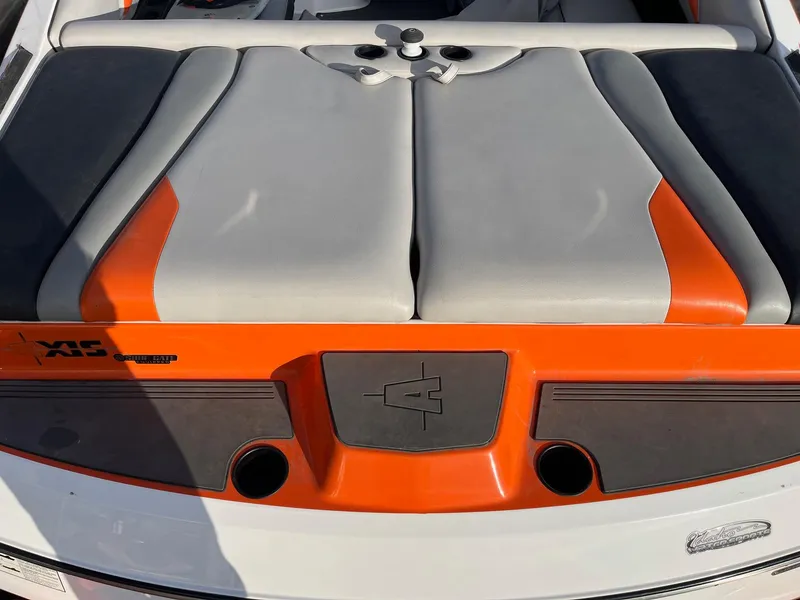 Slide: The Image of 2016 Axis Boats A22 rear deck with orange and gray upholstery. - 13