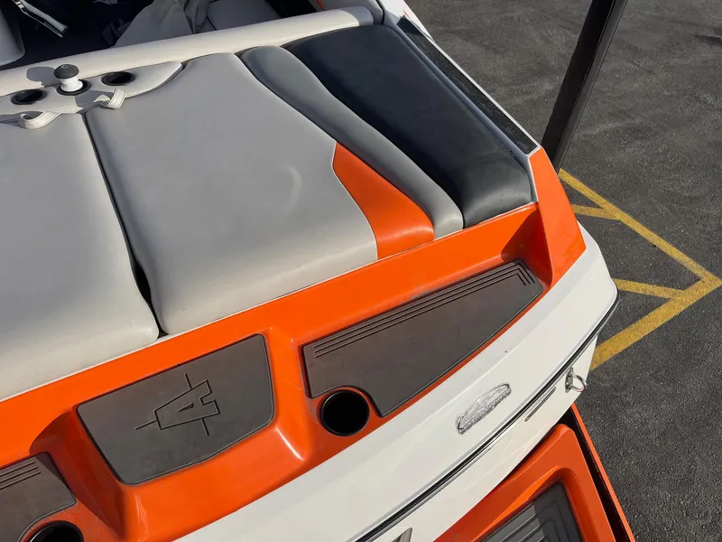 Slide: The Image of 2016 Axis Boats A22 rear seating with orange and gray upholstery. - 15