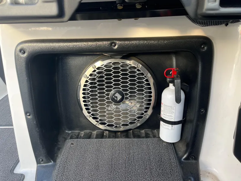 Slide: The Image of 2016 Axis Boats A22 interior with speaker and fire extinguisher. - 27