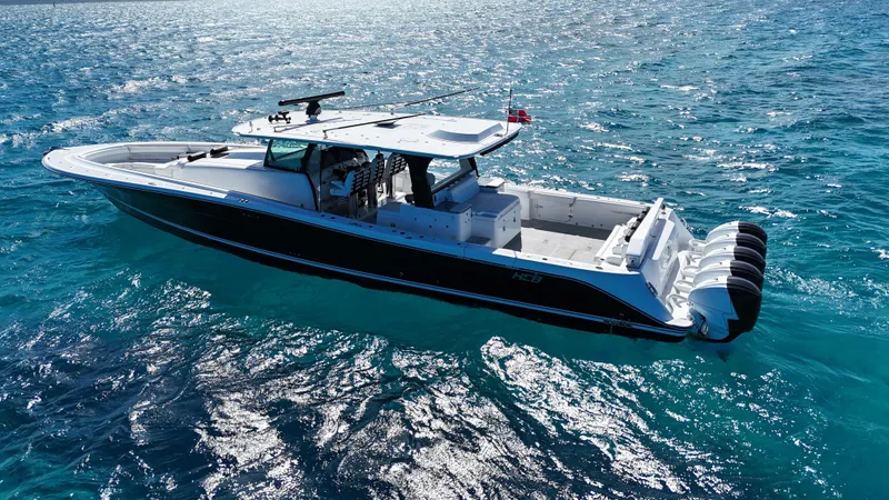 Slide: The Image of 2021 HCB 65 Estrella boat cruising on clear blue ocean waters. - 10