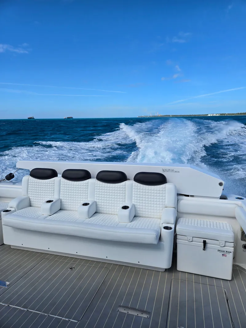 Slide: The Image of Luxury seating on 2021 HCB 65 Estrella yacht cruising through blue ocean waters. - 35