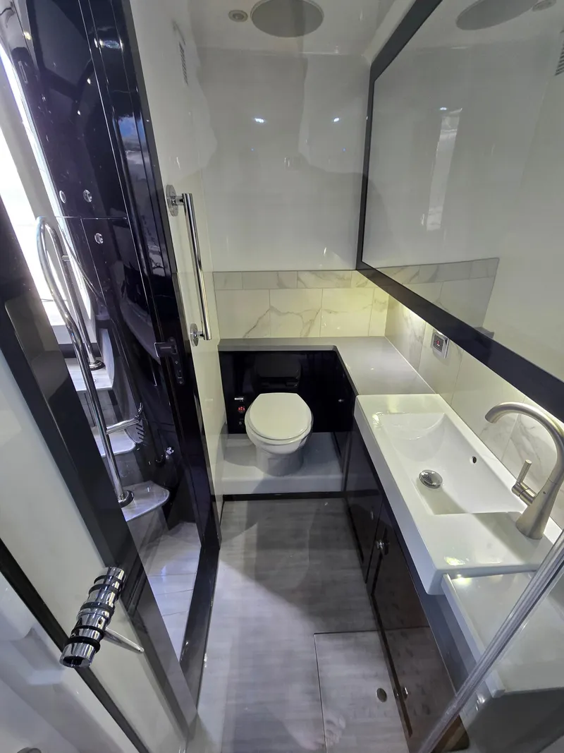 Slide: The Image of Luxurious bathroom in 2021 HCB 65 Estrella yacht, featuring modern fixtures and sleek design. - 42