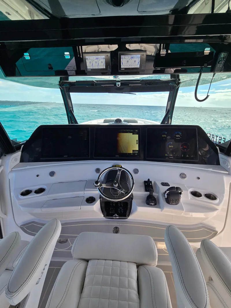 Slide: The Image of Helm of 2021 HCB 65 Estrella yacht with advanced navigation systems and ocean view. - 8