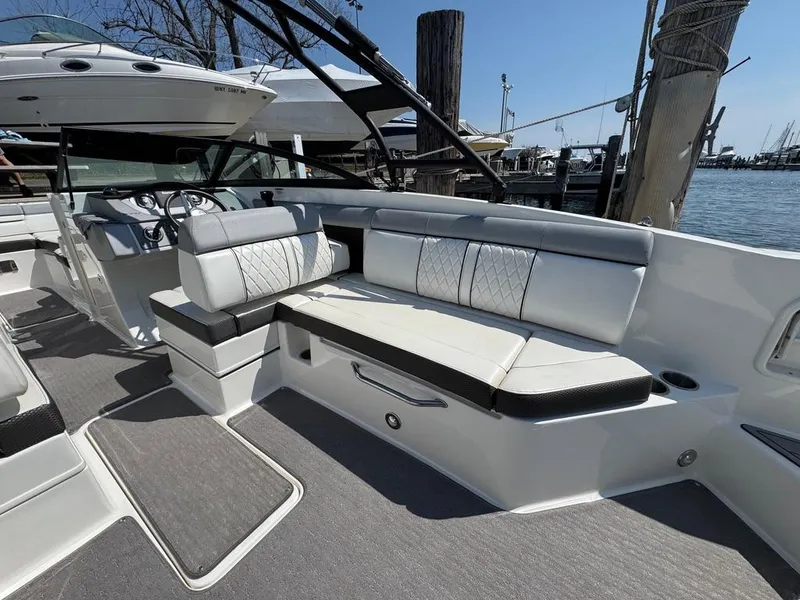 Slide: The Image of 2016 Sea Ray SDX 270 boat interior with sleek seating and modern design. - 11