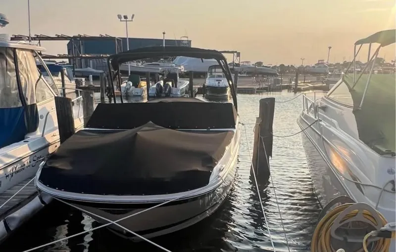 Slide: The Image of 2016 Sea Ray SDX 270 boat docked at marina during sunset. - 15