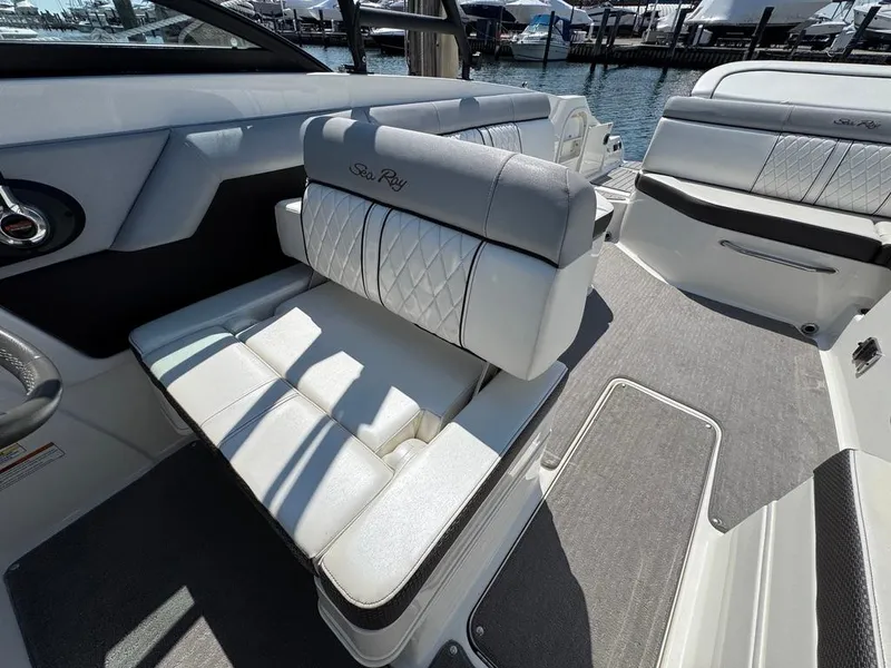 Slide: The Image of 2016 Sea Ray SDX 270 boat interior with white leather seating and elegant design. - 16