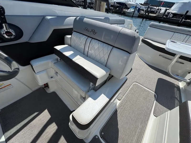 Slide: The Image of 2016 Sea Ray SDX 270 boat interior with luxurious seating and modern design. - 18