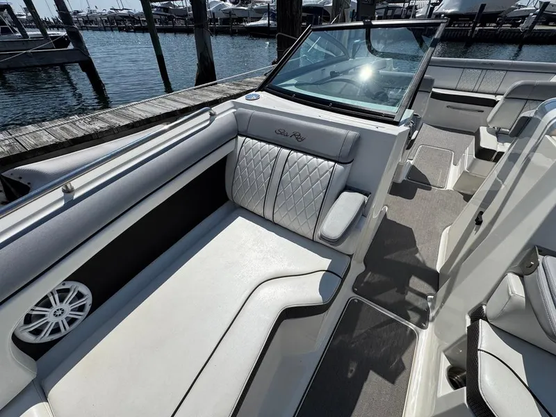 Slide: The Image of 2016 Sea Ray SDX 270 boat interior with luxurious seating and waterfront view. - 22