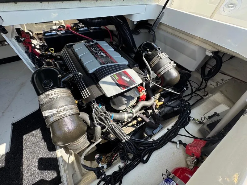 Slide: The Image of Engine compartment of a 2016 Sea Ray SDX 270 boat, showcasing detailed components. - 26