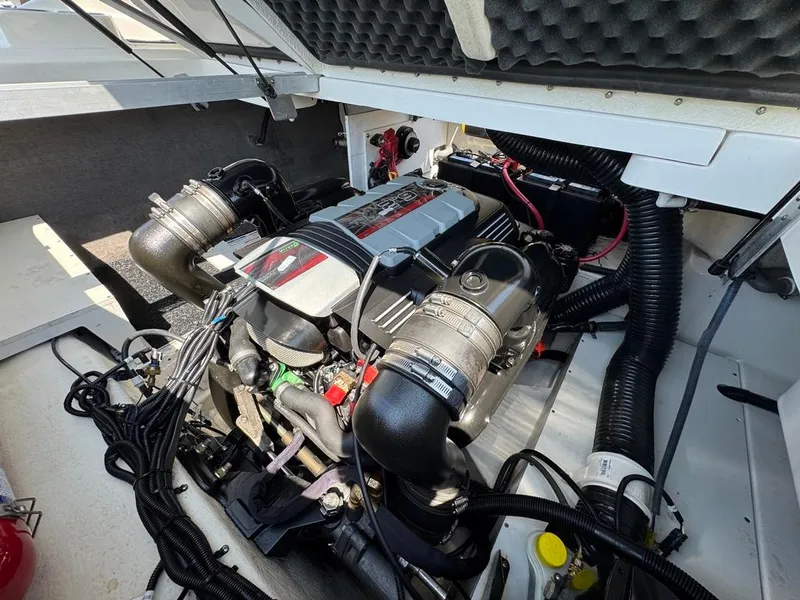 Slide: The Image of Engine compartment of a 2016 Sea Ray SDX 270 boat, showcasing detailed mechanical components. - 27