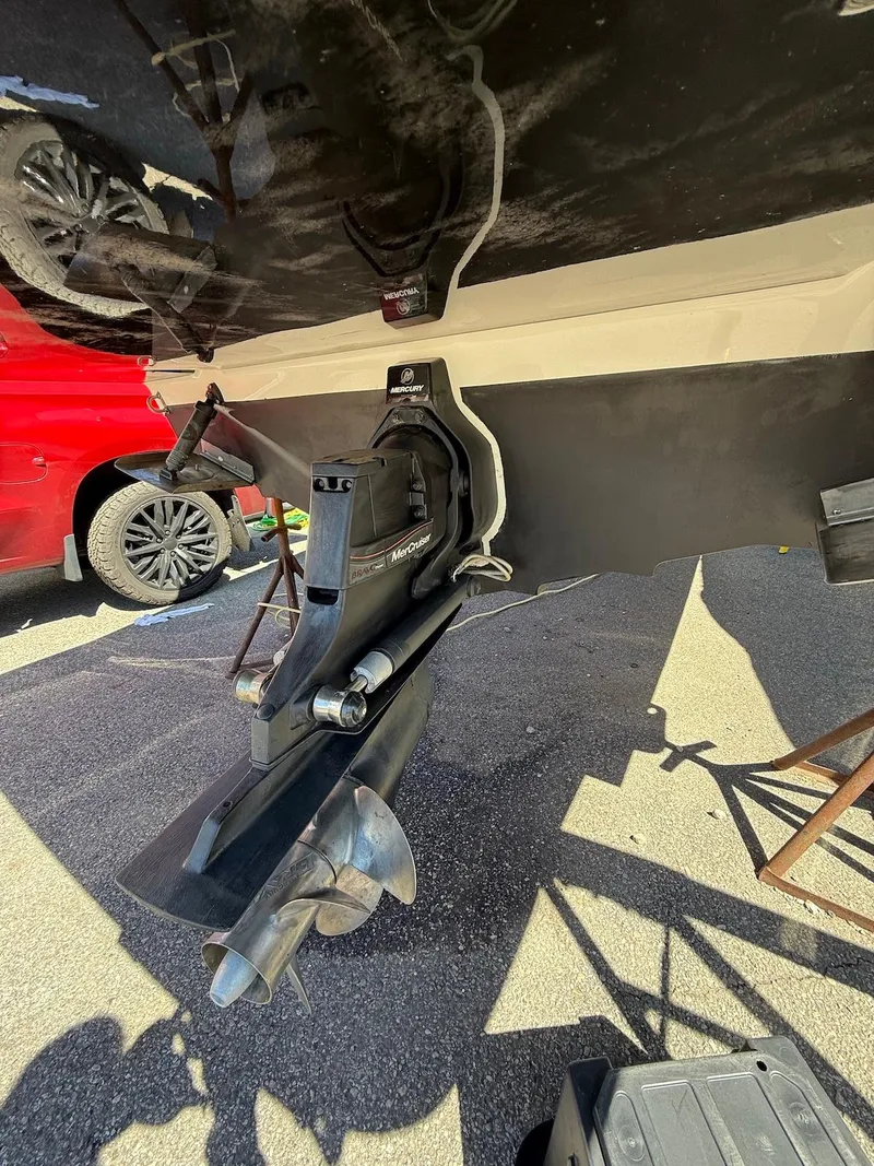 Slide: The Image of 2016 Sea Ray SDX 270 boat stern drive and propeller in a sunny outdoor setting. - 29