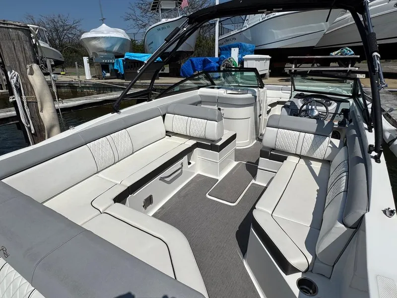 Slide: The Image of 2016 Sea Ray SDX 270 boat interior with spacious seating and modern design. - 4