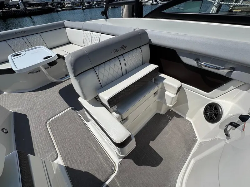 Slide: The Image of 2016 Sea Ray SDX 270 boat interior with plush seating and modern design. - 7