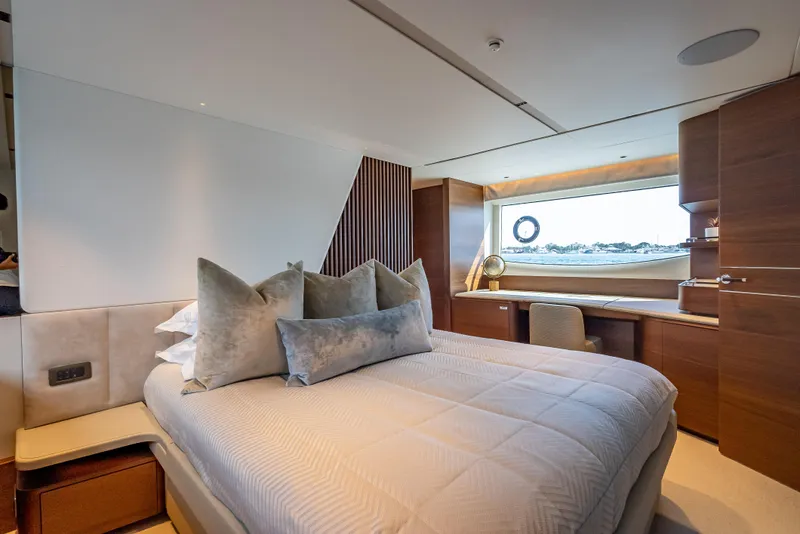 Slide: The Image of Luxurious bedroom interior on 2023 Princess Y72 yacht with elegant decor and large window view. - 45