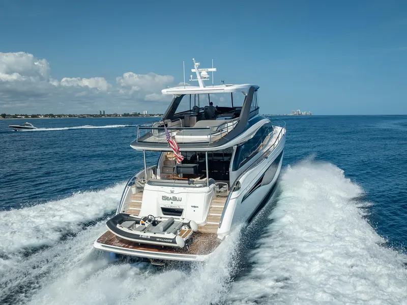 Slide: The Image of 2023 Princess Y72 yacht cruising on open sea under clear blue sky. - 7