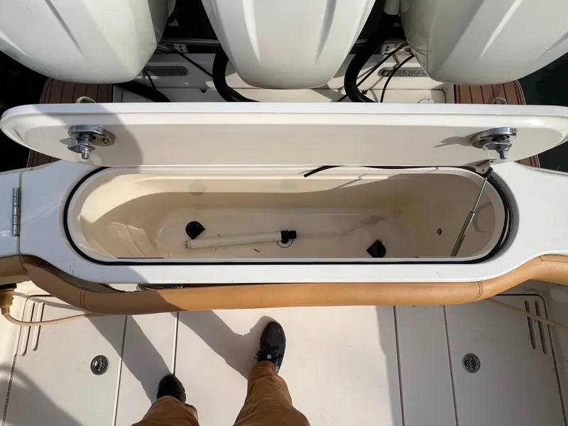 Slide: The Image of Open storage compartment on a 2016 Scout 350 LXF boat deck. - 27