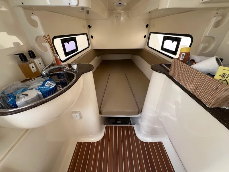 Slide: The Image of 2016 Scout 350 LXF cabin interior with sink, bed, and storage. - 34
