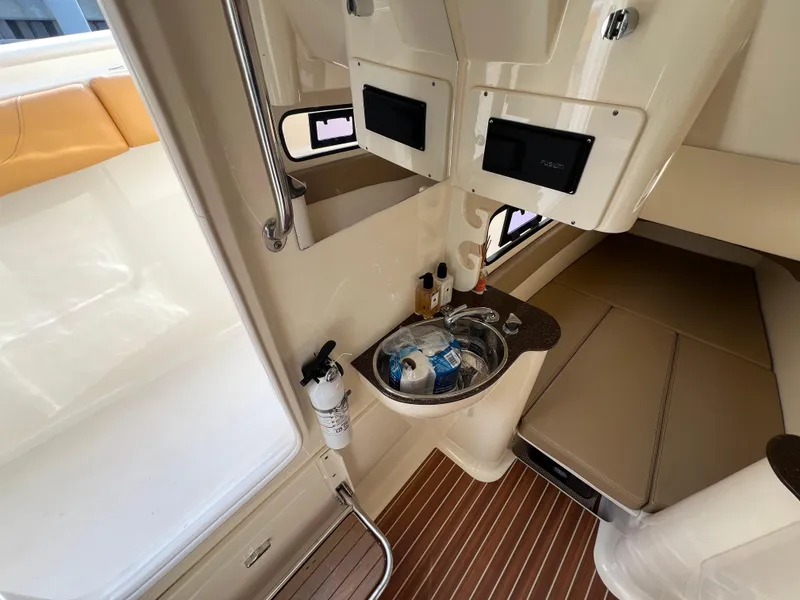 Slide: The Image of Interior of 2016 Scout 350 LXF boat with sink and seating area. - 35