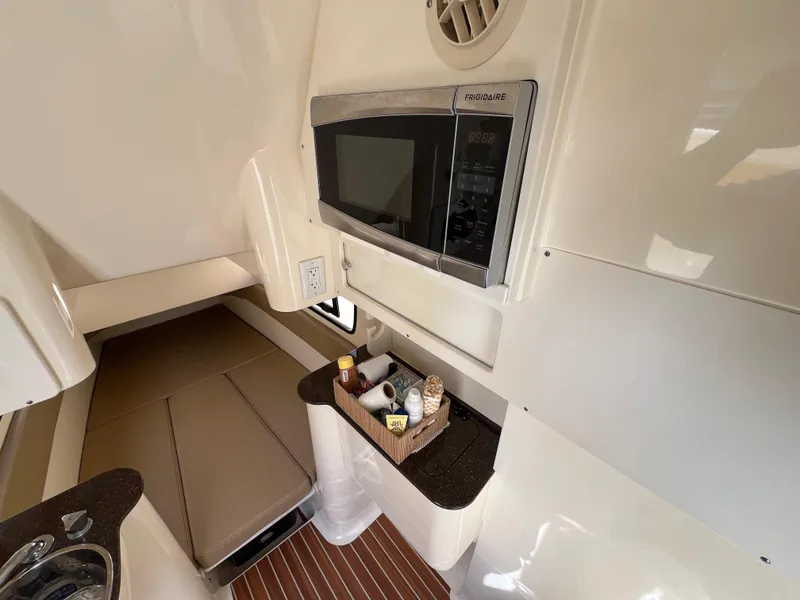 Slide: The Image of 2016 Scout 350 LXF cabin interior with microwave and storage basket. - 36