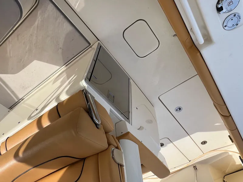 Slide: The Image of Interior view of 2016 Scout 350 LXF boat with tan leather seating. - 41