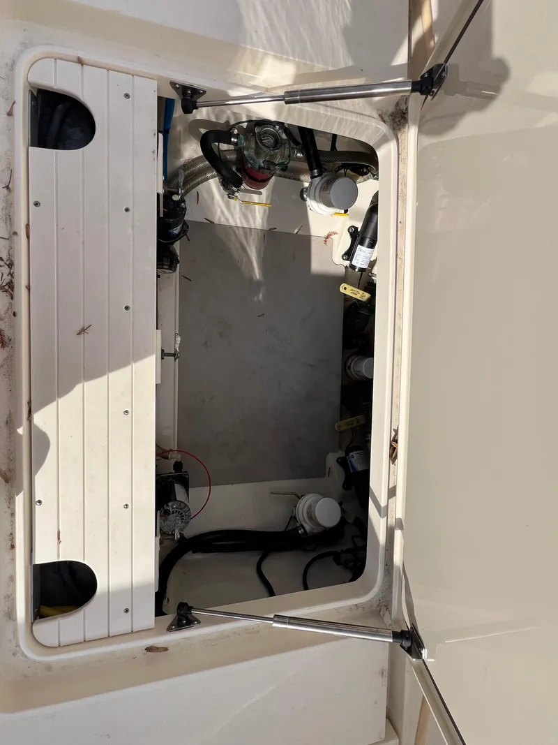 Slide: The Image of Open hatch of 2016 Scout 350 LXF boat showing internal components. - 45