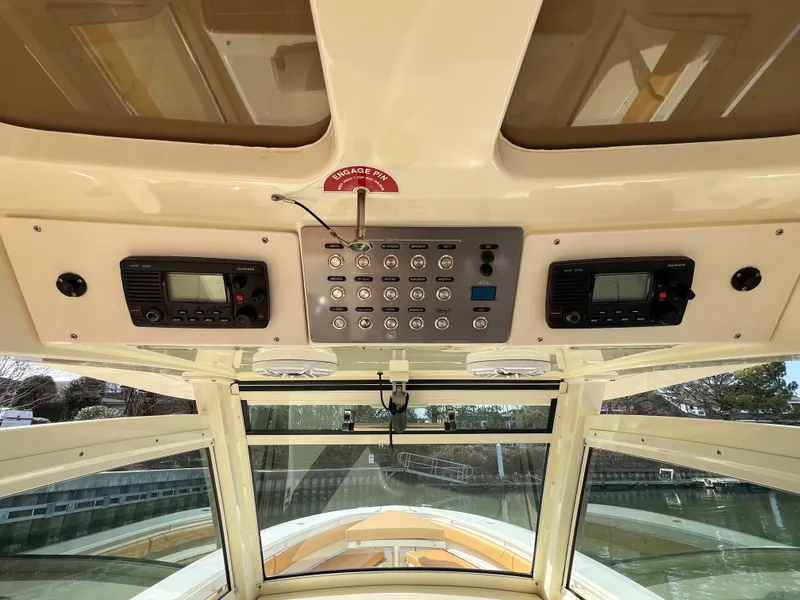 Slide: The Image of Control panel of a 2016 Scout 350 LXF boat, featuring navigation and communication equipment. - 46