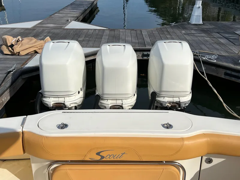 Slide: The Image of 2016 Scout 350 LXF boat with triple outboard engines at dock. - 47