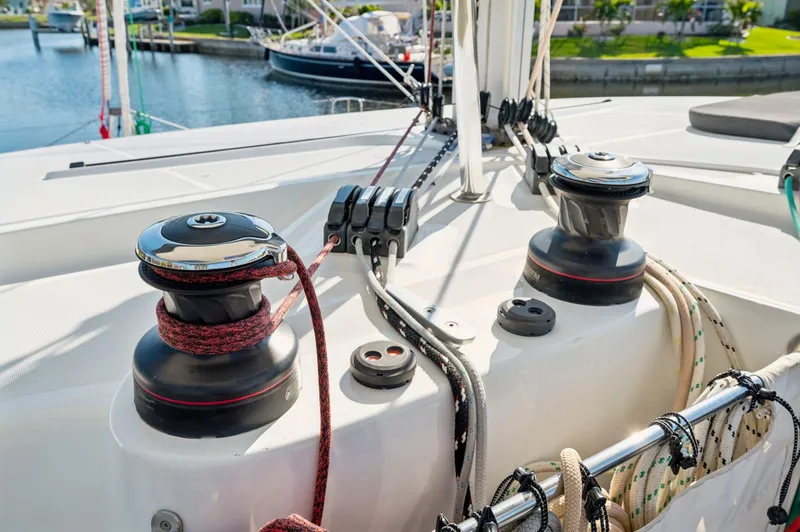 Slide: The Image of Deck of 2019 Lagoon 42 catamaran with winches and ropes in marina setting. - 18