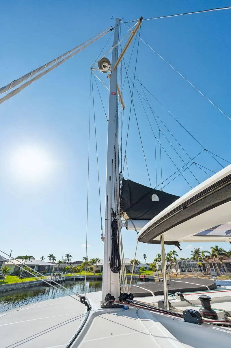 Slide: The Image of 2019 Lagoon 42 sailboat mast and rigging under clear blue sky. - 32