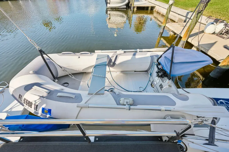 Slide: The Image of 2019 Lagoon 42 catamaran docked with inflatable dinghy on deck. - 47