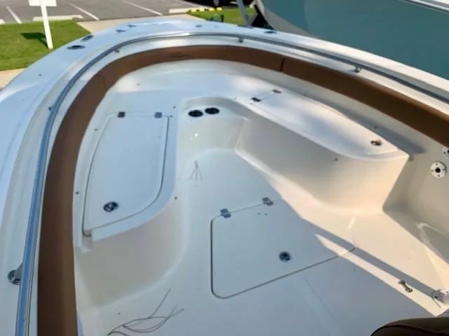 Slide: The Image of 2025 Pioneer 222 Islander boat interior with seating and storage compartments. - 11