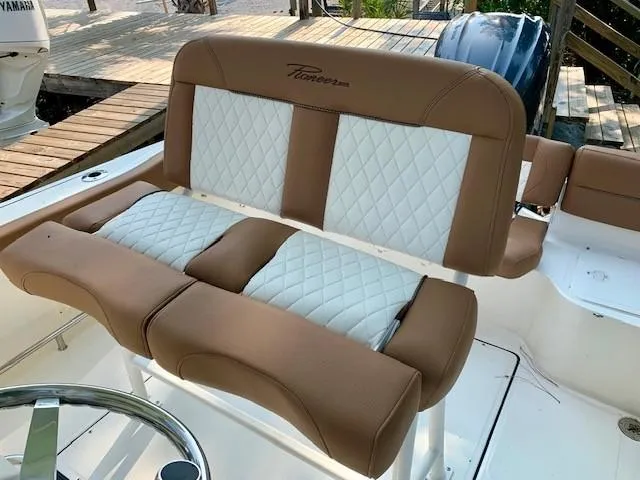 Slide: The Image of 2025 Pioneer 222 Islander boat seat with brown and white quilted upholstery. - 9
